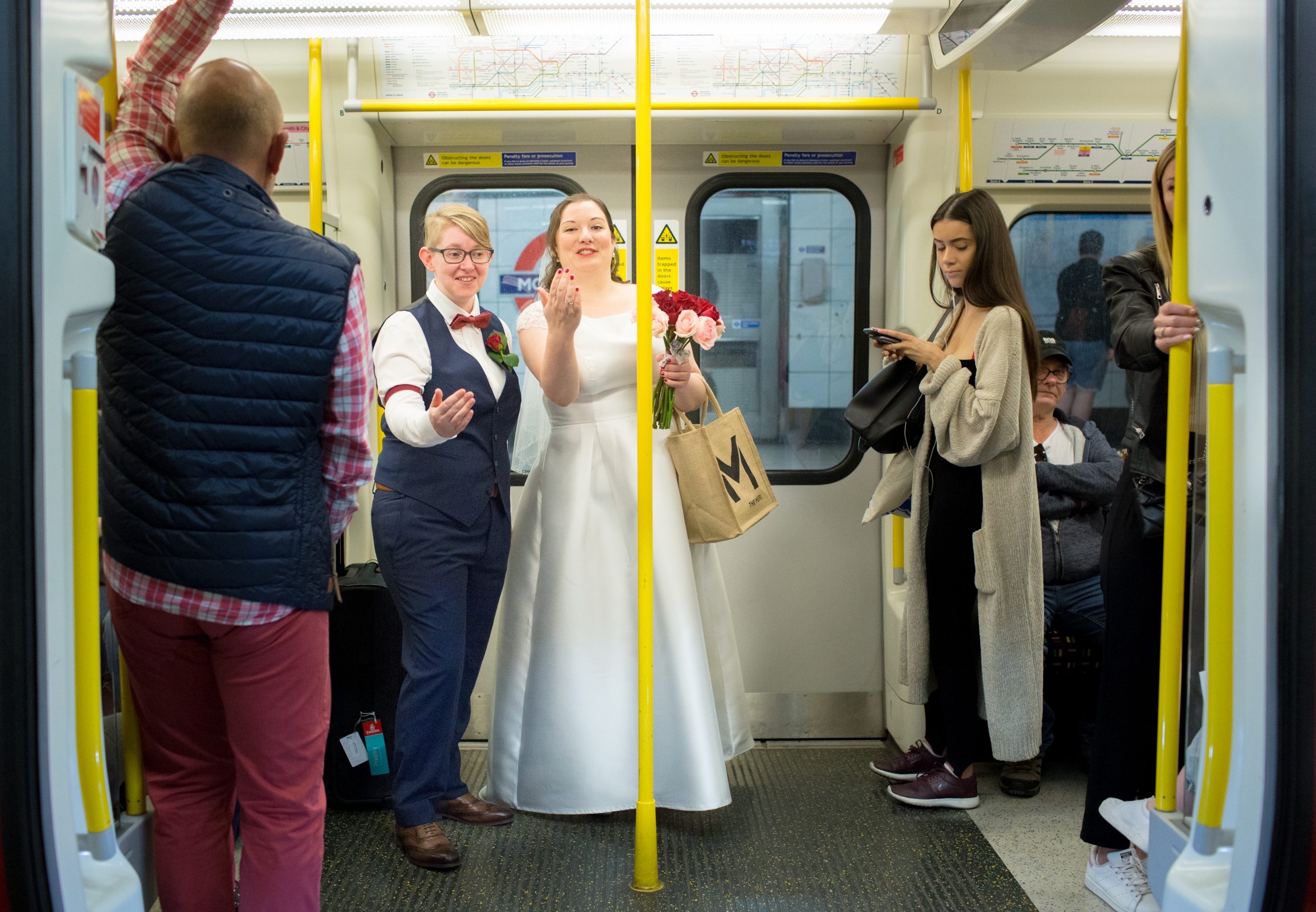 two brides on a tube train in London