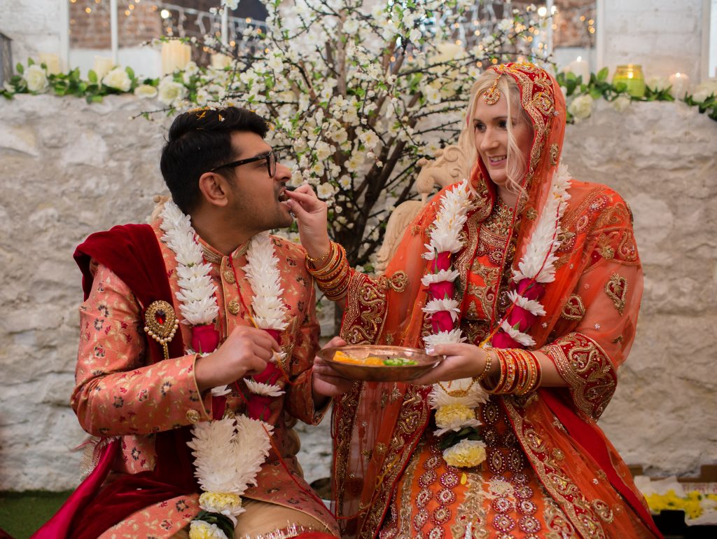 bride feeding groom during ceremony at the sweeney hotel
