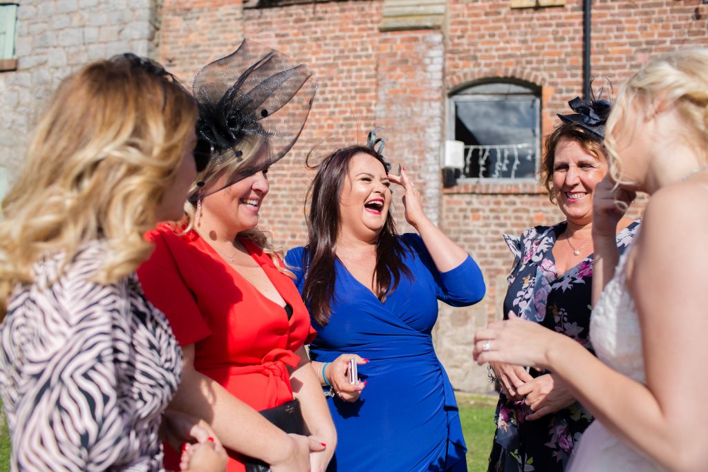 guests laughing at wedding